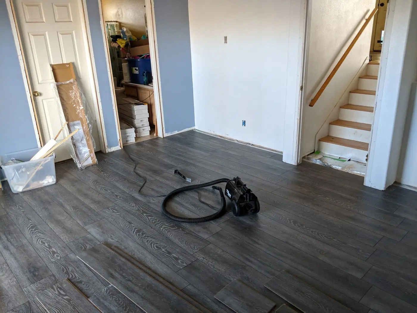 Finished plank flooring near the stairs