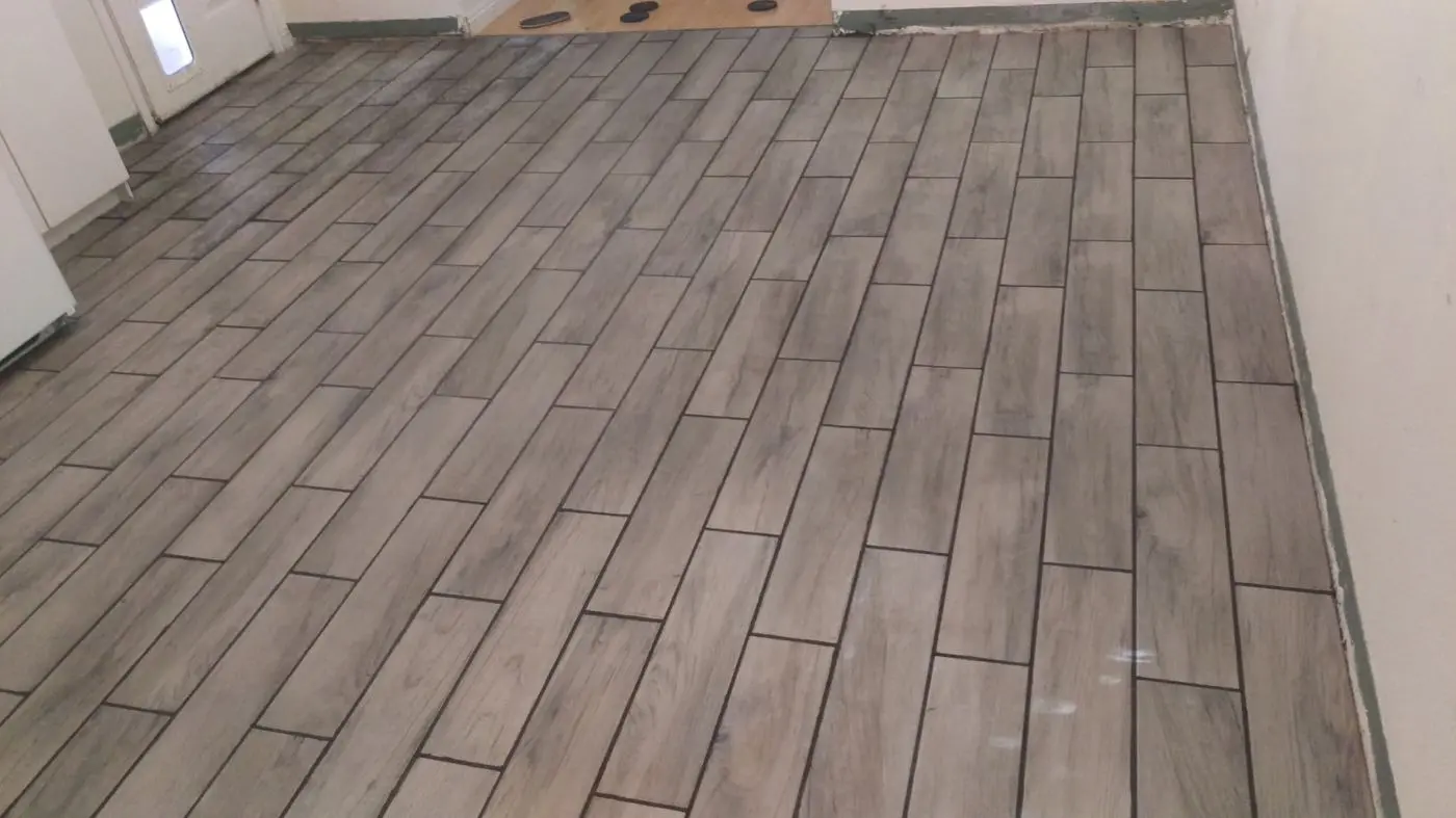 Finished tile flooring by the doorway
