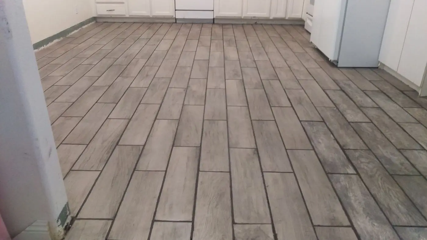 Finished tile flooring, kitchen view